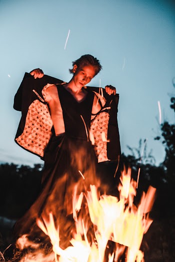 Man Standing Beside Bonfire