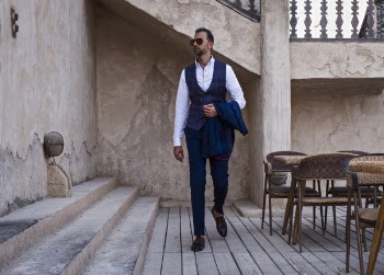 Man Standing Beside Brown Concrete Stairs