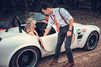 Man Standing Beside Convertible