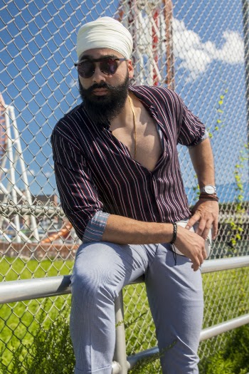 Man Standing Beside Fence