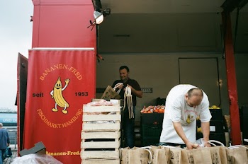 Man Standing Beside Gift Bags