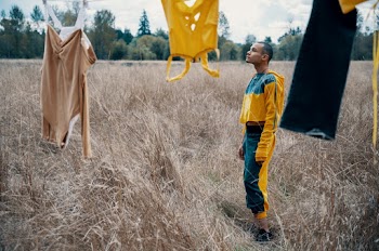 Man Standing Beside Hanged Clothes