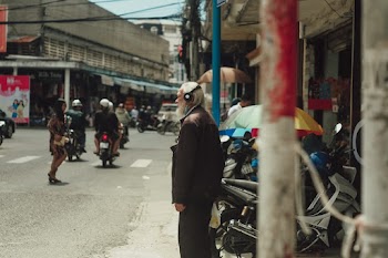 Man Standing Beside Motorcycle