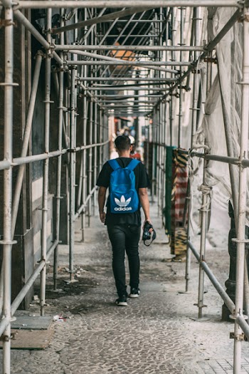 Man Standing Beside Pipes