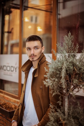 Man Standing Beside Plant