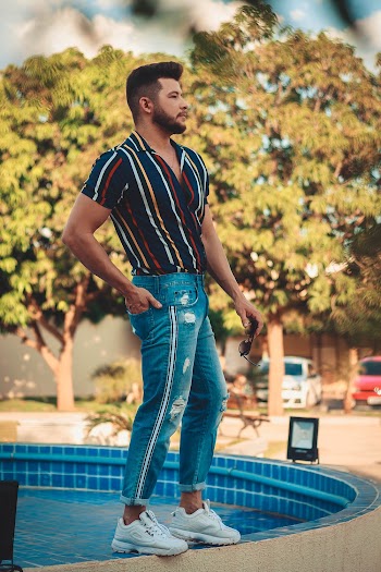 Man Standing Beside Pool