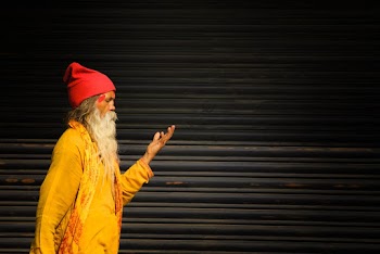 Man Standing Beside Roller Shutter