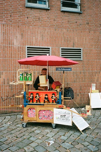 Man Standing Beside Stall