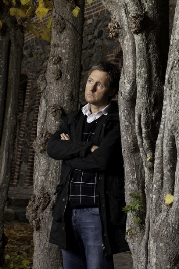Man Standing Beside Tree