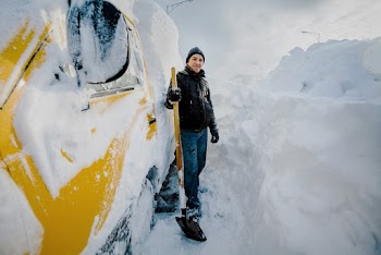 Man Standing Beside Vehicle