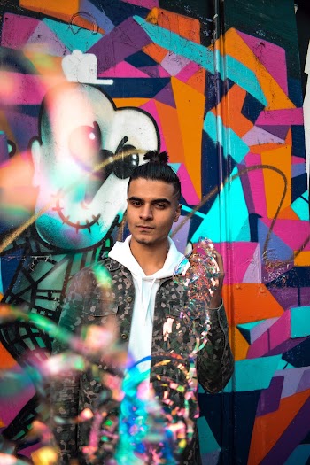 Man Standing Beside Wall