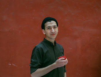 Man Standing Beside Wall