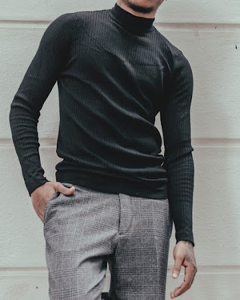 Man Standing Beside Wall