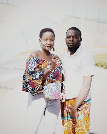 Man Standing Beside Woman Holding White Umbrella