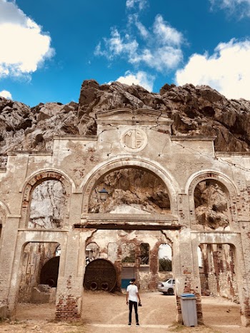 Man Standing in Arc Gate