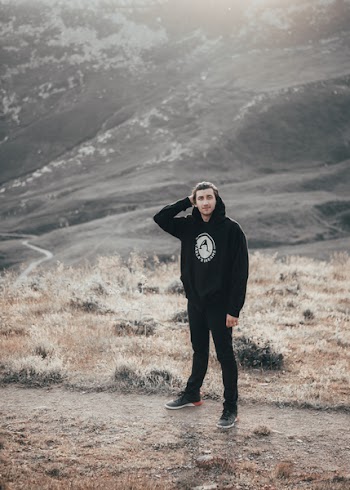 Man Standing In Black Hoodie