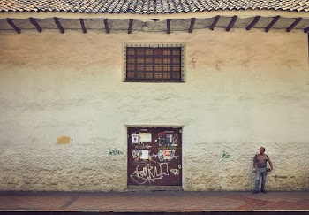 Man Standing in Front of a Building