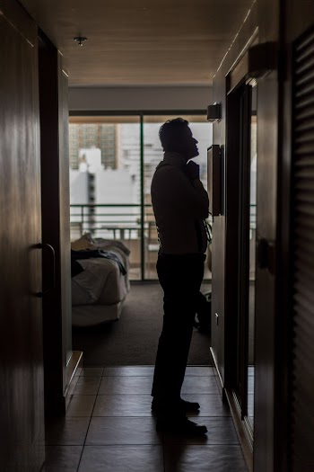Man Standing In Front Of A Mirror