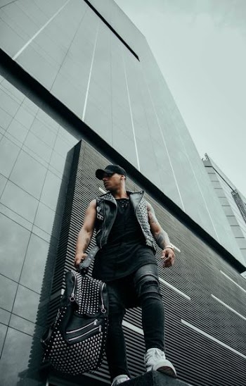 man standing in front of building