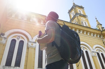 Man Standing in Front of Cathedral