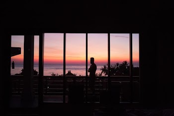 man standing in front of glass wall