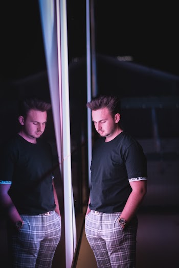 Man Standing in Front of Mirror