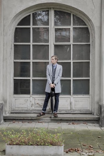 Man Standing in Front of Mirrored Window