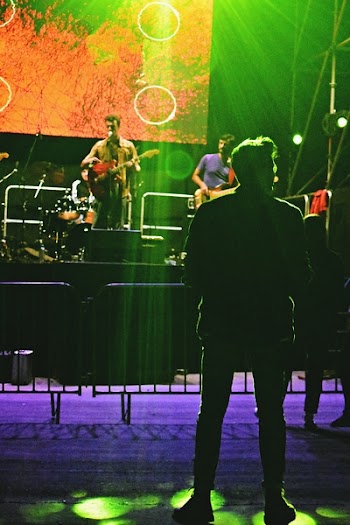 Man Standing in Front of Stage