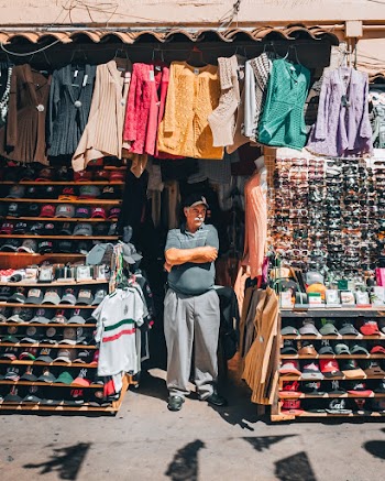 Man Standing in Front of Store