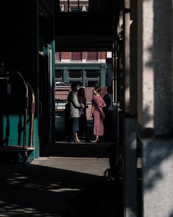 man standing in front of woman