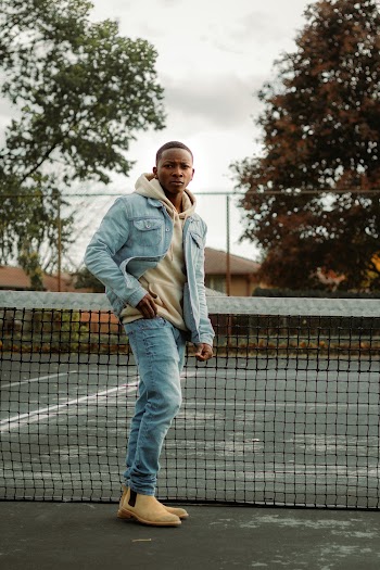 Man Standing in Tennis Court