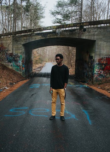 Man Standing In The Center of Road
