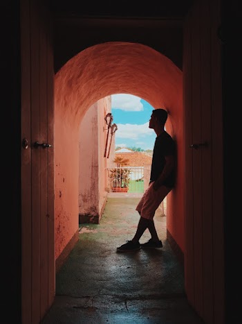 Man Standing In The Hallway