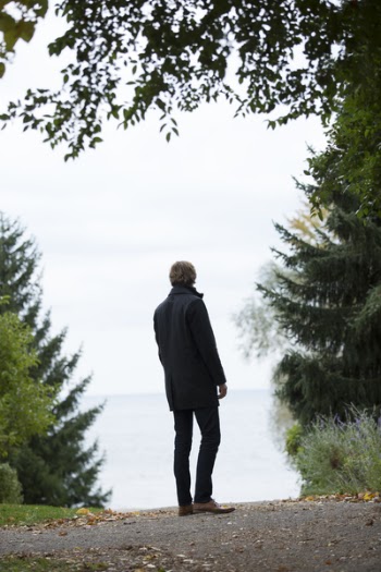 Man Standing in the Middle of Empty Road