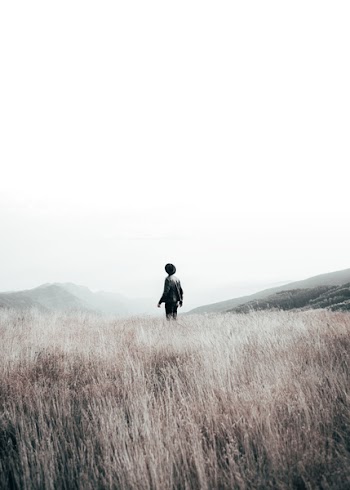 Man Standing in the Middle of Field