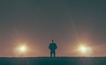 man standing in the middle of nowhere