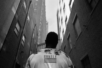 man standing in the middle of two buildings