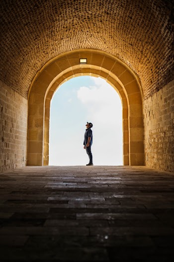 Man Standing Inside A Temple