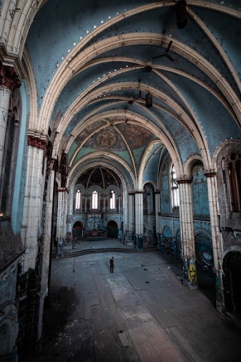 Man Standing Inside Abandoned Building