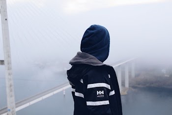 Man Standing Looking Down