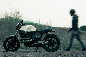 Man Standing Near Black and White Bmw Standard Motorcycle