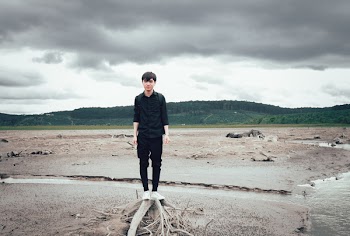 Man Standing Near Body of Water