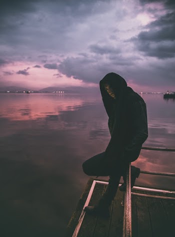 Man Standing Near Body of Water