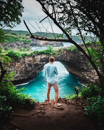 Man Standing Near Body of Water