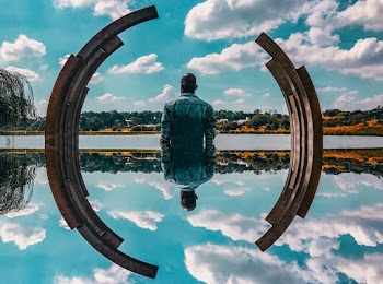 Man Standing Near Body of Water