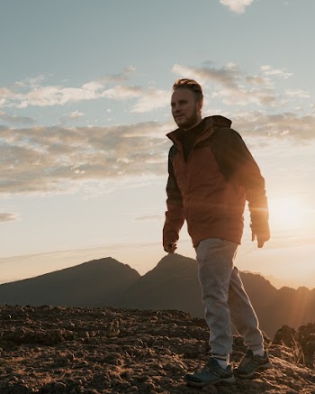 Man Standing Near Brown Ground