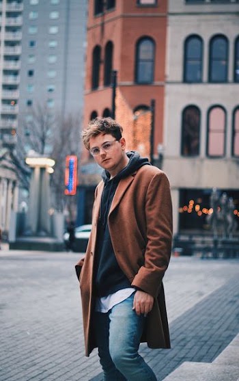 man standing near building
