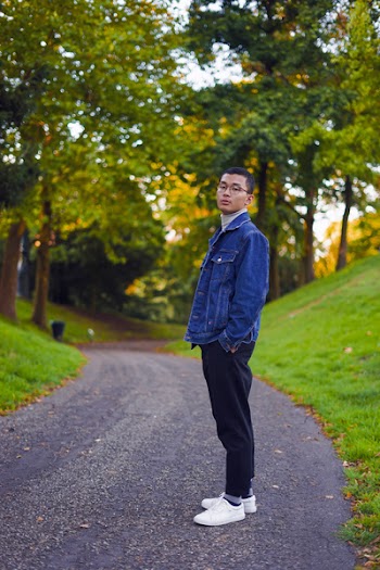 Man Standing Near Green Trees