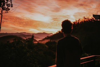 Man Standing Near Handrail