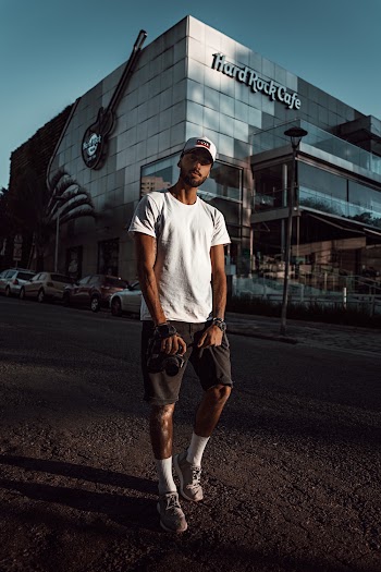Man Standing Near Hard Rock Café